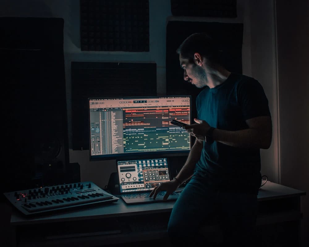 Man creating music on a laptop